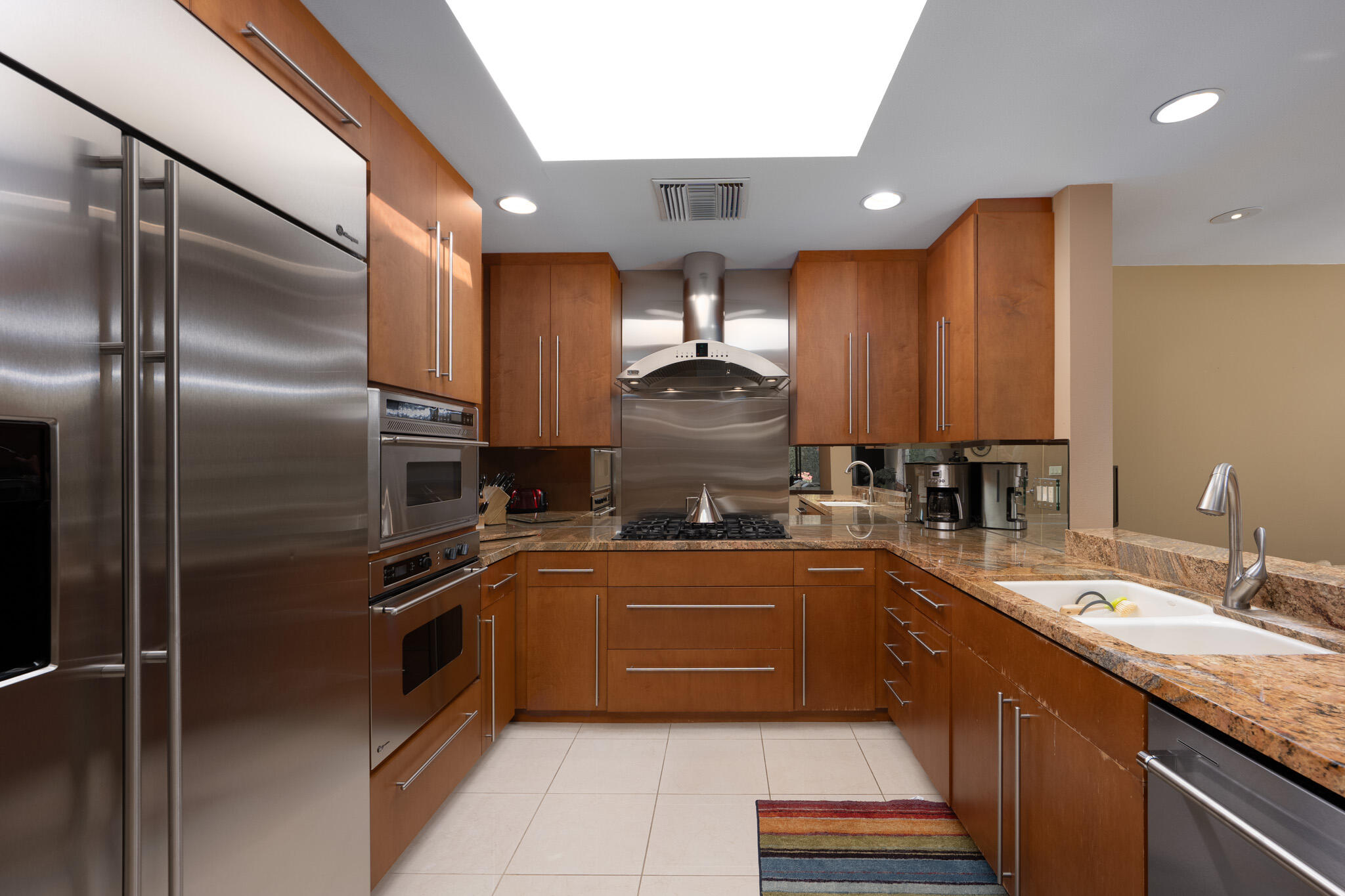 52 Princeton Drive Rancho Mirage, CA 92270 - Photo 13 of 52 a kitchen with stainless steel appliances granite countertop a sink a stove and a refrigerator