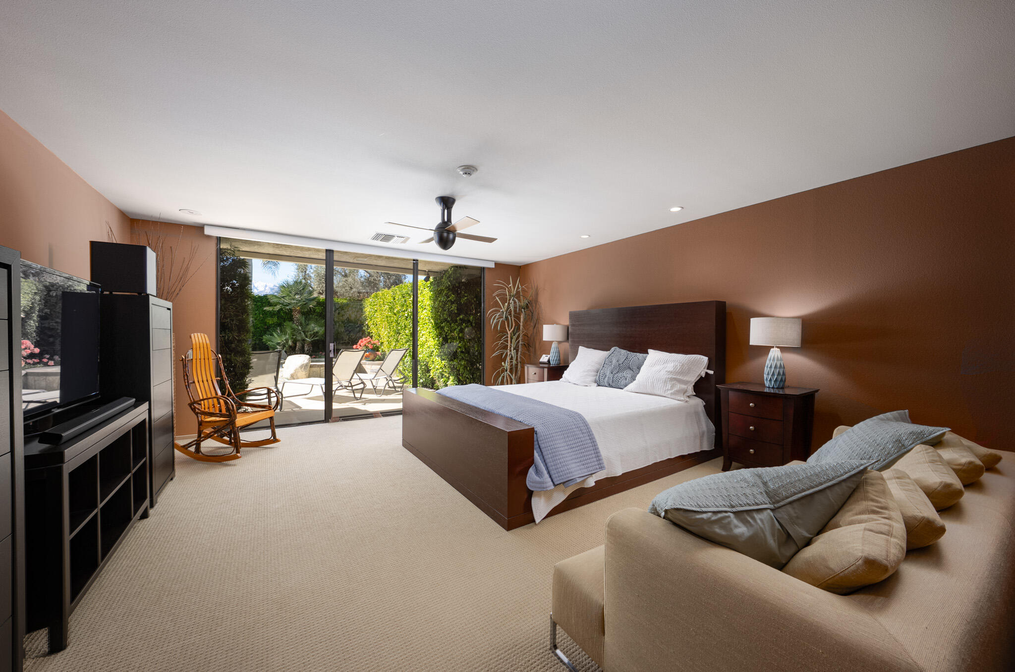 52 Princeton Drive Rancho Mirage, CA 92270 - Photo 16 of 52 a bedroom with bed and large flat tv screen on dresser