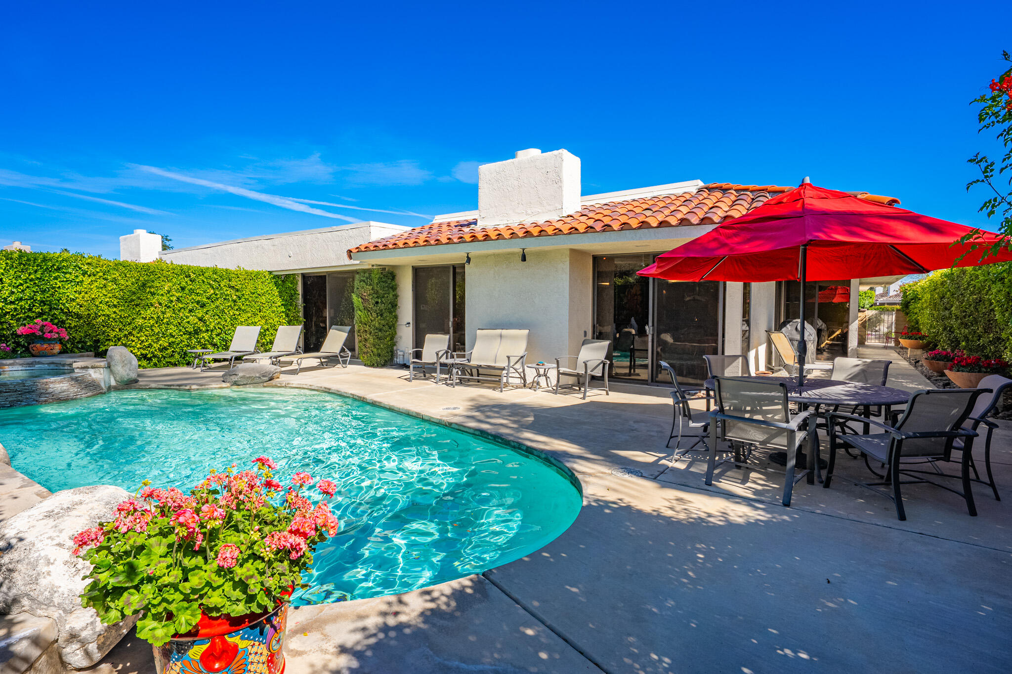 52 Princeton Drive Rancho Mirage, CA 92270 - Photo 34 of 52 a view of a patio with chairs and potted plants