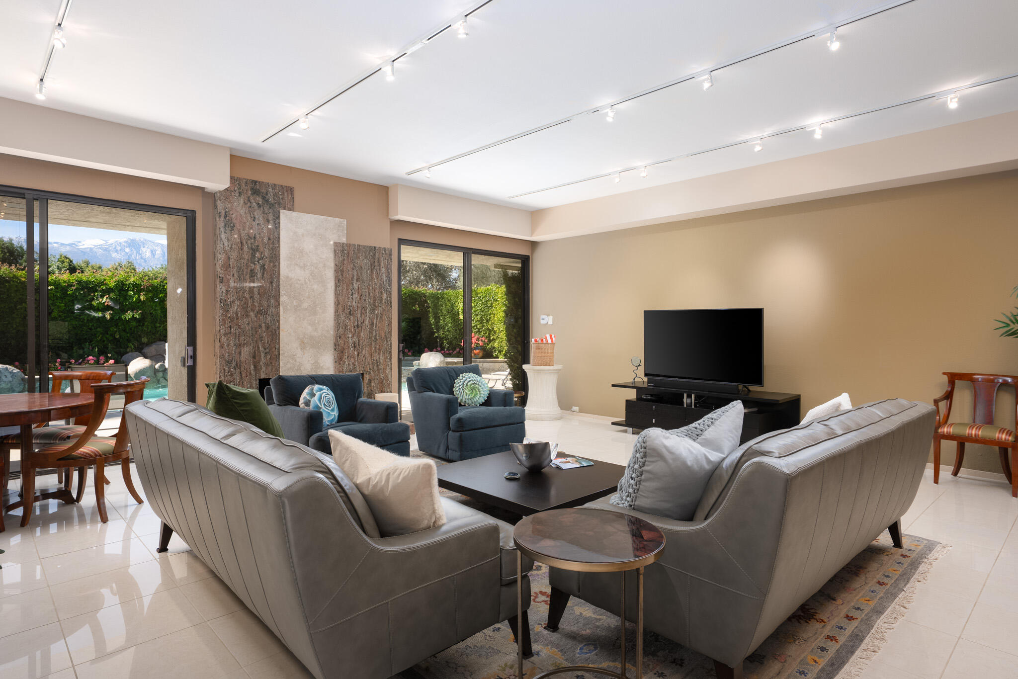 52 Princeton Drive Rancho Mirage, CA 92270 - Photo 9 of 52 a living room with furniture and a flat screen tv