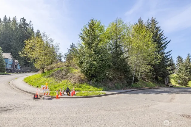 a view of a cars park on the side of the road
