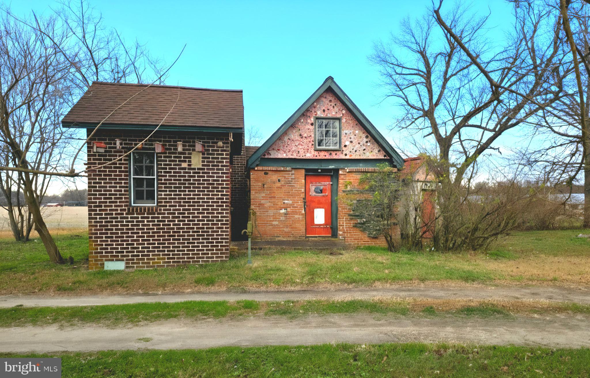 27329 Iron Gate Road Federalsburg, MD 21632 - Photo 11 of 57 a front view of a house with a yard