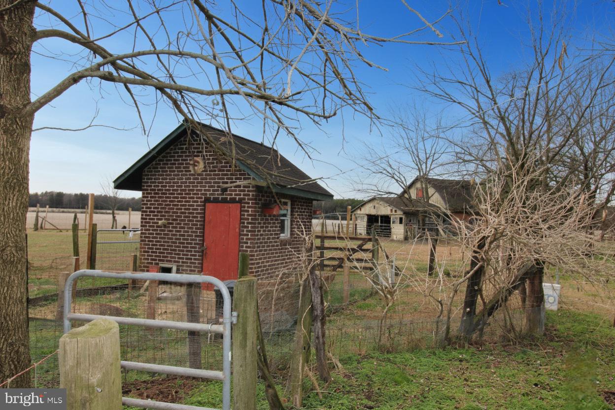 27329 Iron Gate Road Federalsburg, MD 21632 - Photo 15 of 57 a front view of a house with a yard