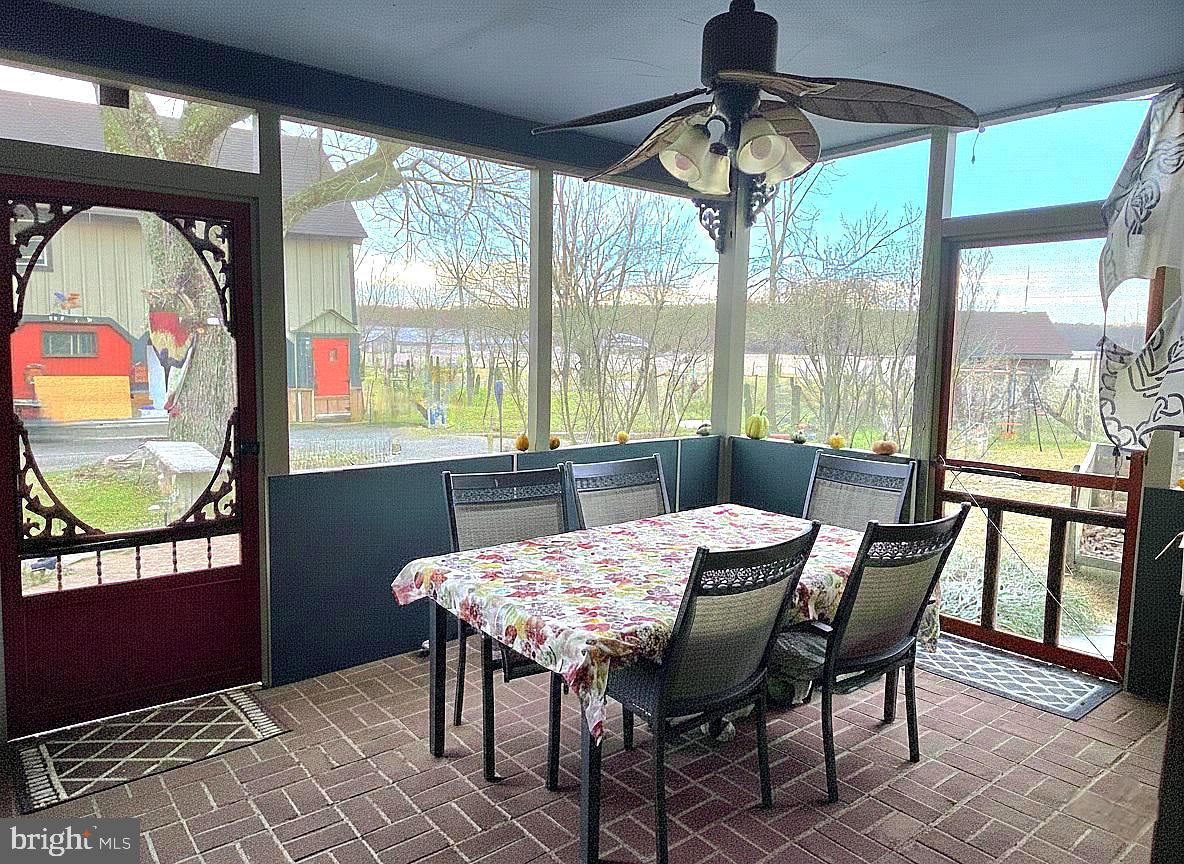 27329 Iron Gate Road Federalsburg, MD 21632 - Photo 21 of 57 a view of a dining room with furniture window and outside view