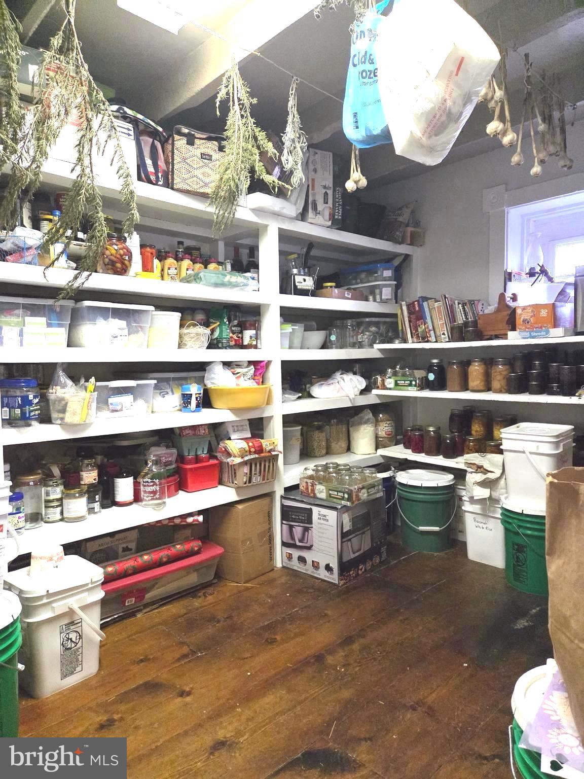 27329 Iron Gate Road Federalsburg, MD 21632 - Photo 29 of 57 a room with shelves and a wooden floor