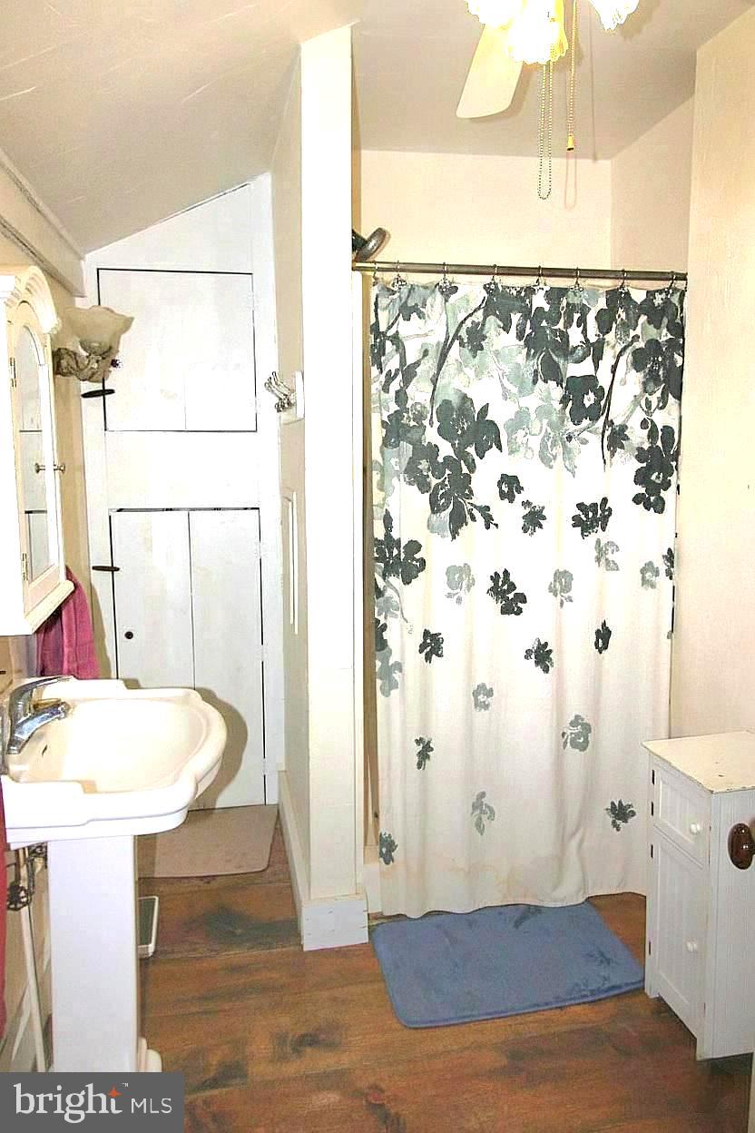 27329 Iron Gate Road Federalsburg, MD 21632 - Photo 34 of 57 a bathroom with a sink and a mirror