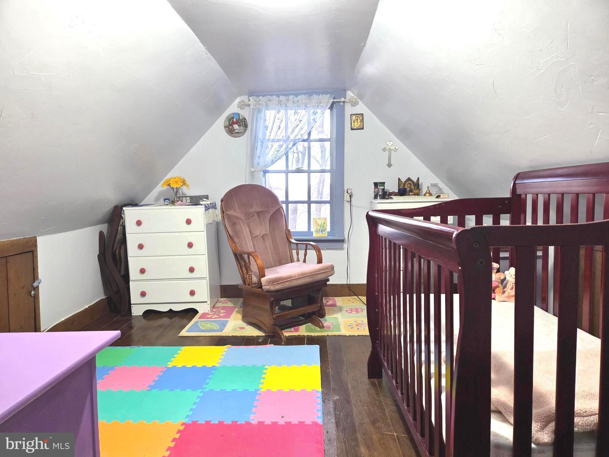 27329 Iron Gate Road Federalsburg, MD 21632 - Photo 51 of 57 a view of a bedroom with baby crib furniture and windows