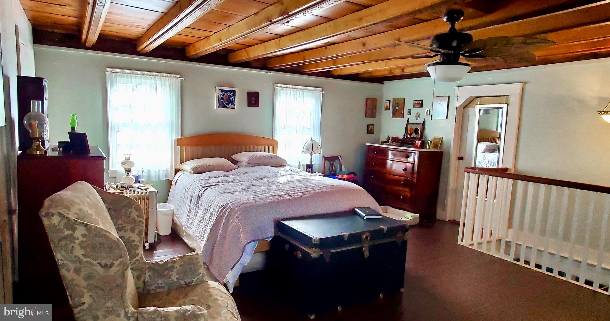 27329 Iron Gate Road Federalsburg, MD 21632 - Photo 56 of 57 a bedroom with bed and wooden floors