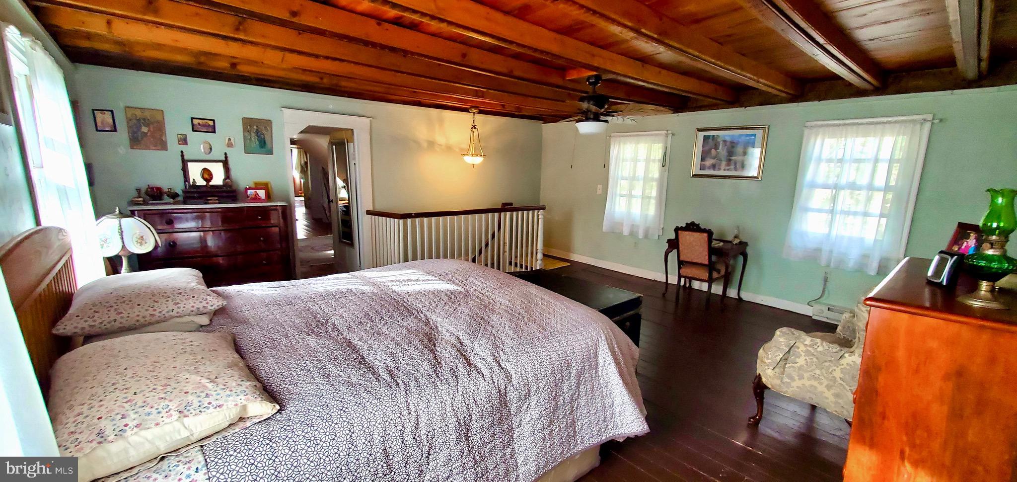 27329 Iron Gate Road Federalsburg, MD 21632 - Photo 57 of 57 a bedroom with a bed a couch and dresser