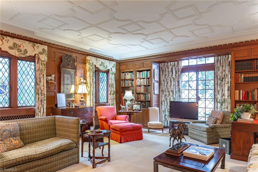 3215 North Rockingham Road Greensboro, NC 27407 - Photo 21 of 50 Ornate plaster ceiling above pegged wood panel walls