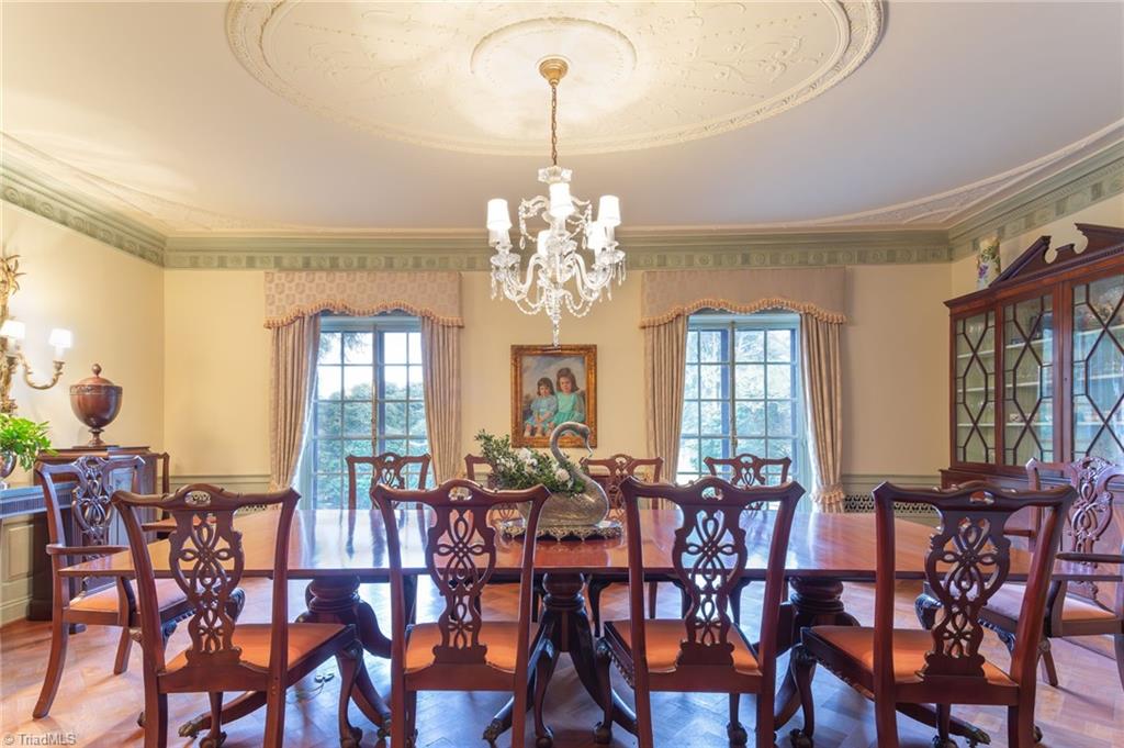 3215 North Rockingham Road Greensboro, NC 27407 - Photo 25 of 50 Plaster ceiling medallian references the Gorham Adam silver pattern. Beautiful hardwood parquet floors