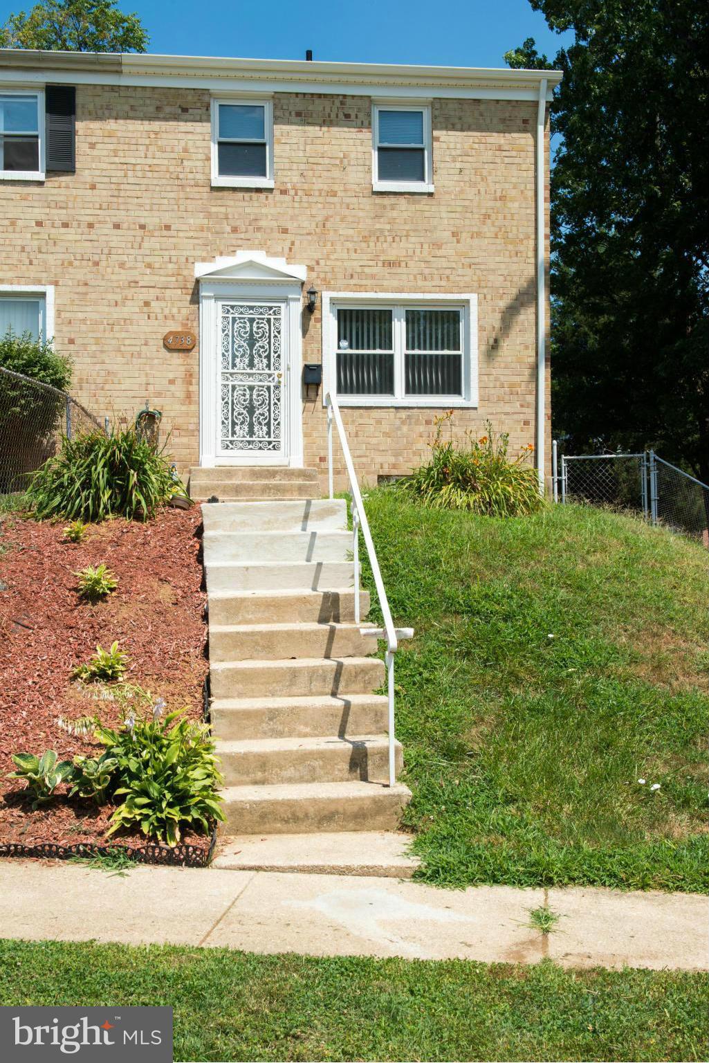 4738 Vancouver Road Baltimore, MD 21229 - Photo 1 of 30 a front view of a house with a yard