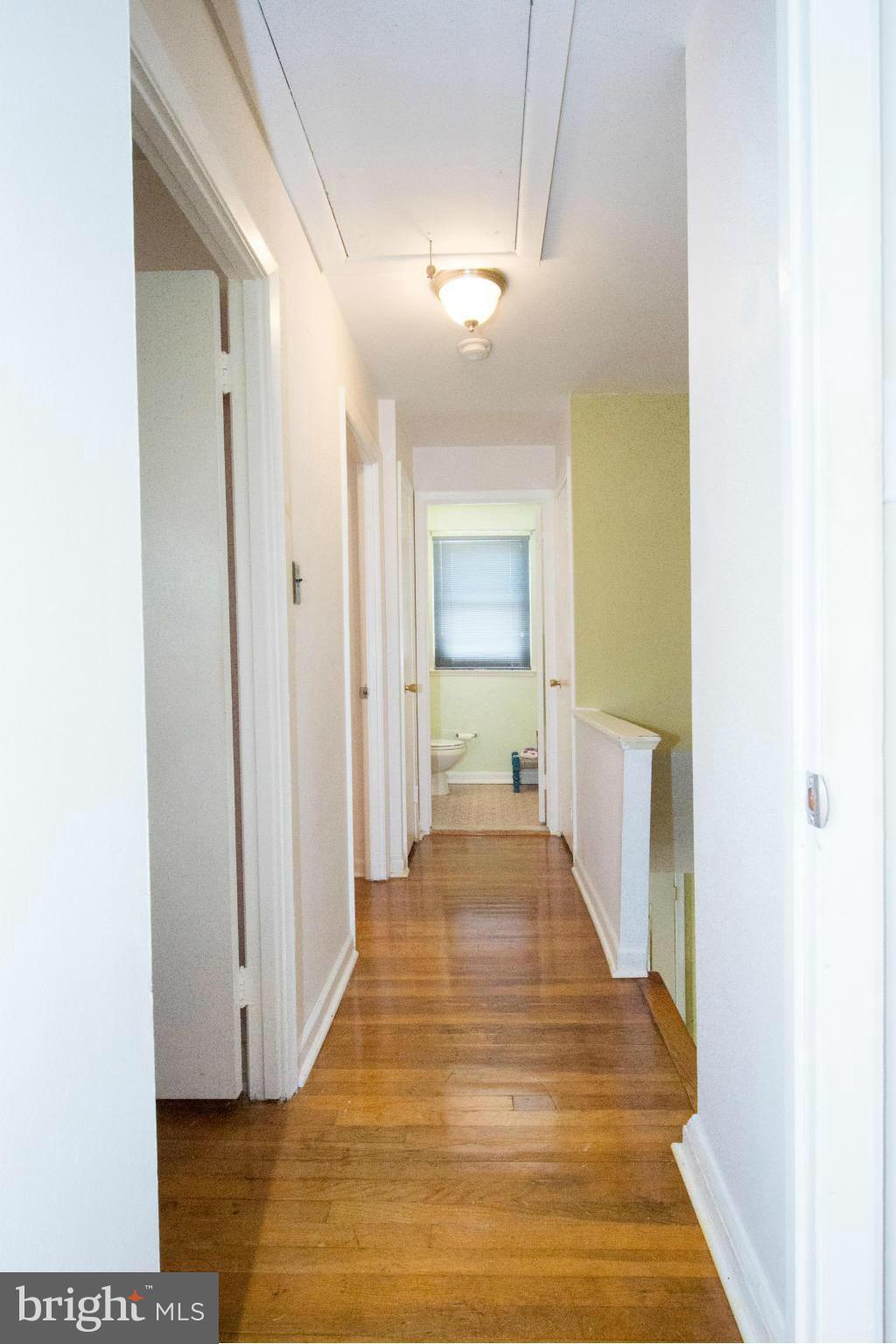 4738 Vancouver Road Baltimore, MD 21229 - Photo 11 of 30 a view of a hallway with wooden floor