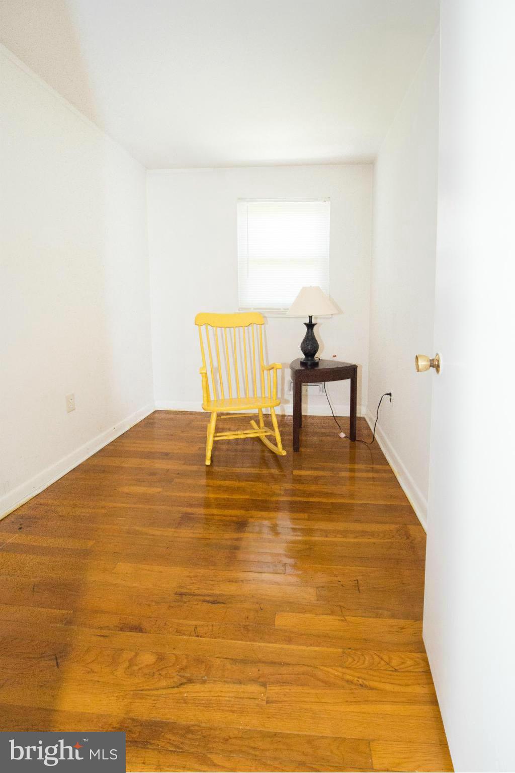 4738 Vancouver Road Baltimore, MD 21229 - Photo 14 of 30 a view of a room with wooden floor and a table