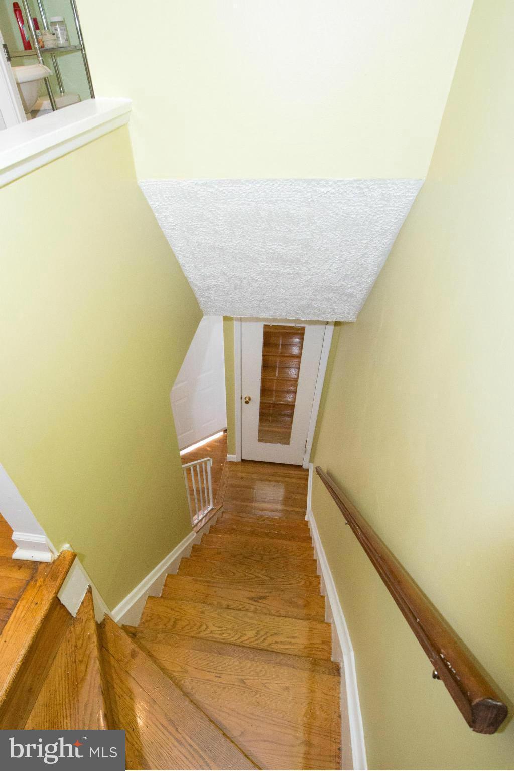 4738 Vancouver Road Baltimore, MD 21229 - Photo 15 of 30 a view of a room with wooden floor and a hallway
