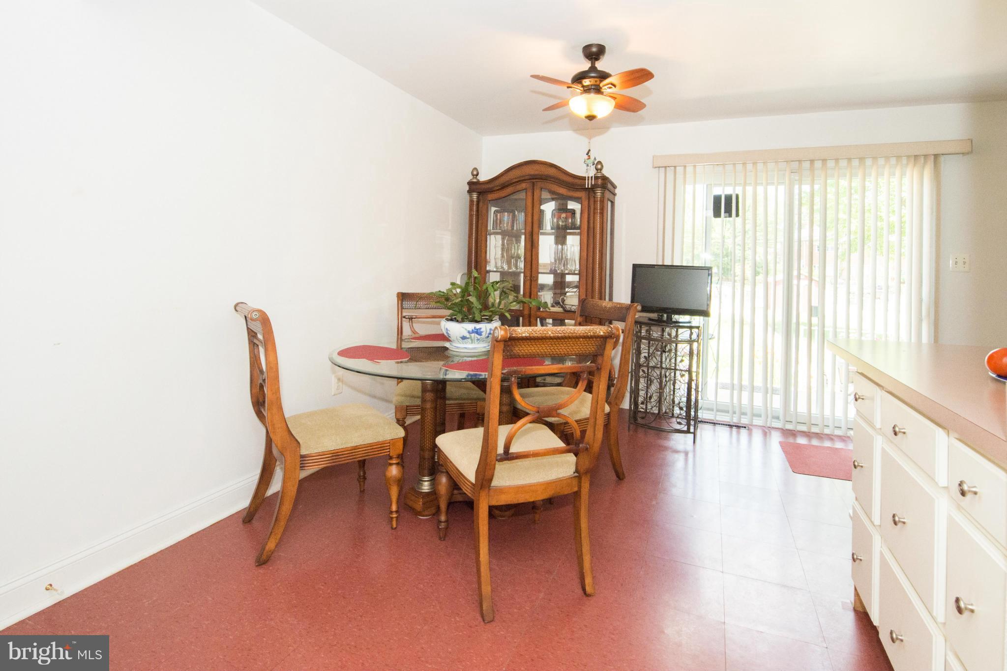 4738 Vancouver Road Baltimore, MD 21229 - Photo 19 of 30 a view of a dining room with furniture window and wooden floor