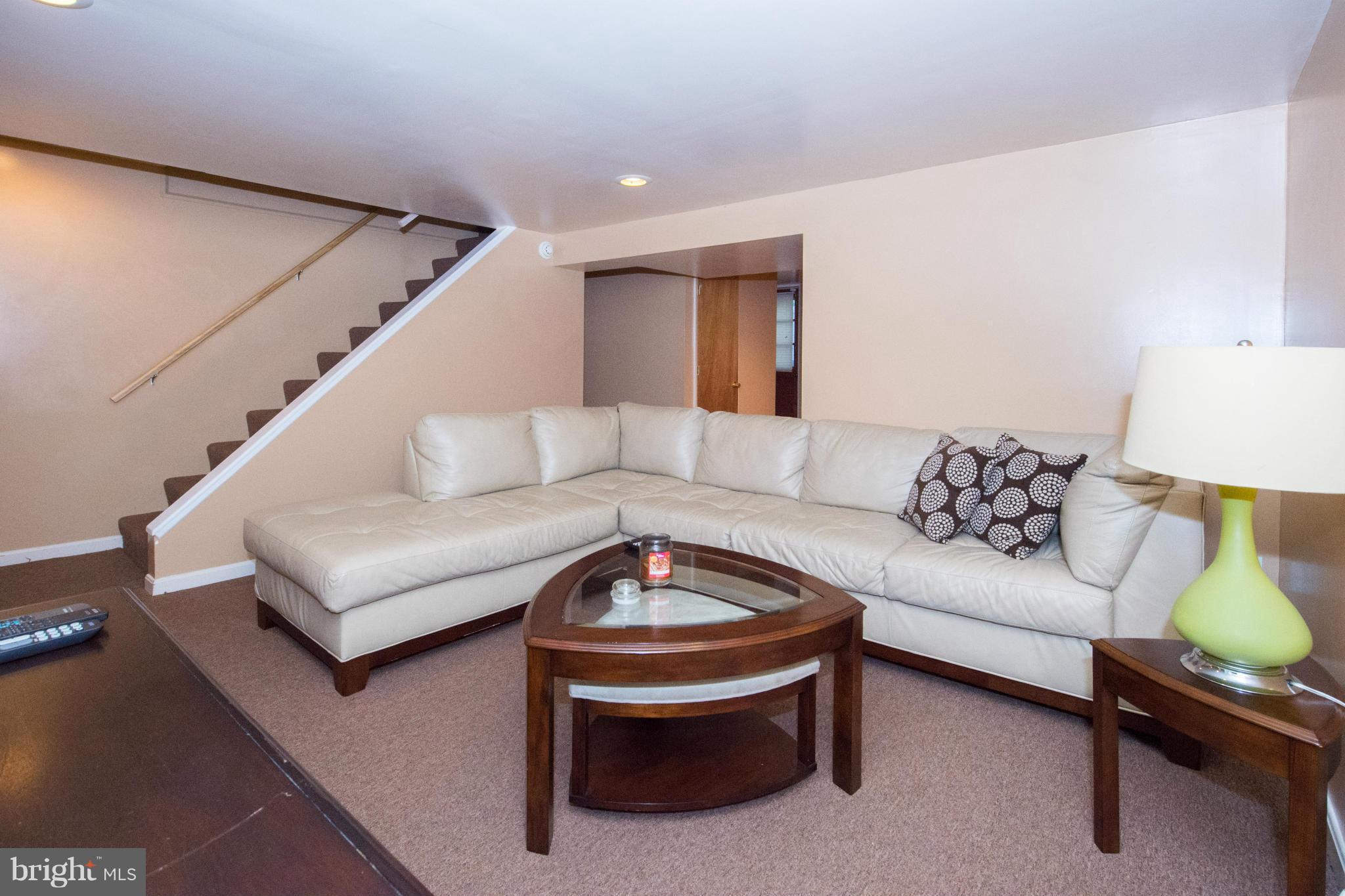 4738 Vancouver Road Baltimore, MD 21229 - Photo 22 of 30 a living room with furniture and a lamp