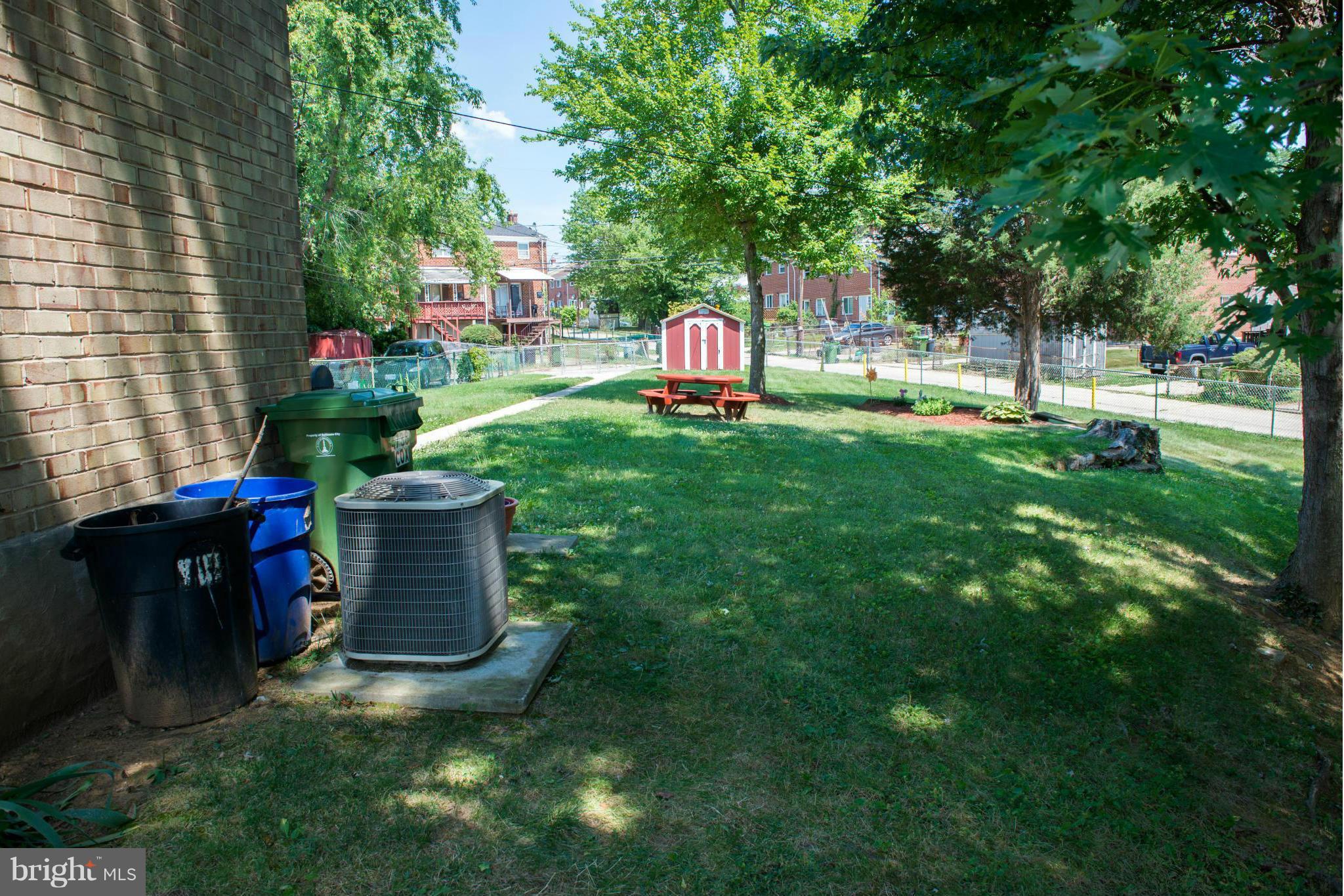 4738 Vancouver Road Baltimore, MD 21229 - Photo 27 of 30 a front view of a house with a yard and tree s