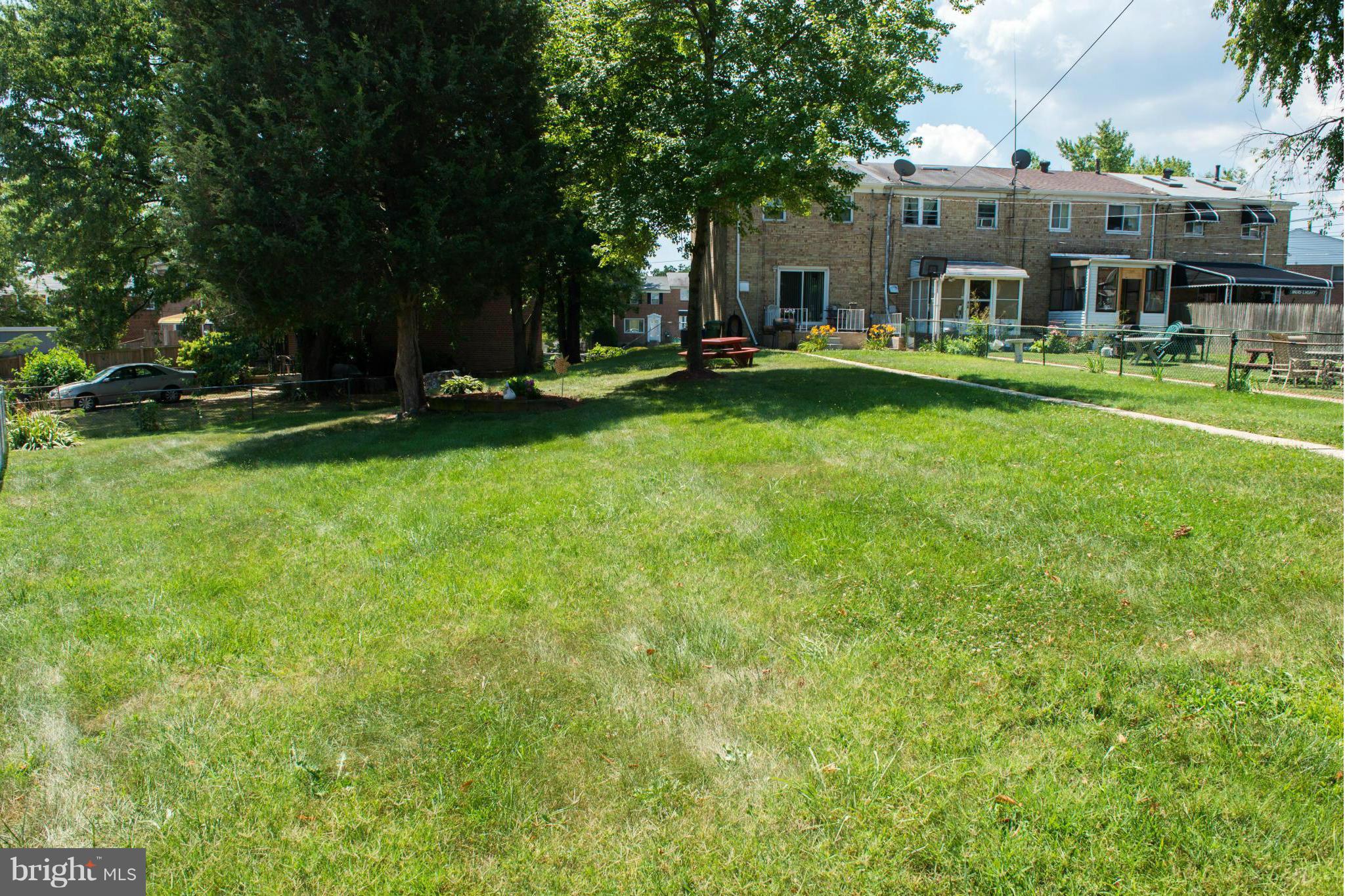 4738 Vancouver Road Baltimore, MD 21229 - Photo 28 of 30 a view of a building with a yard and sitting area