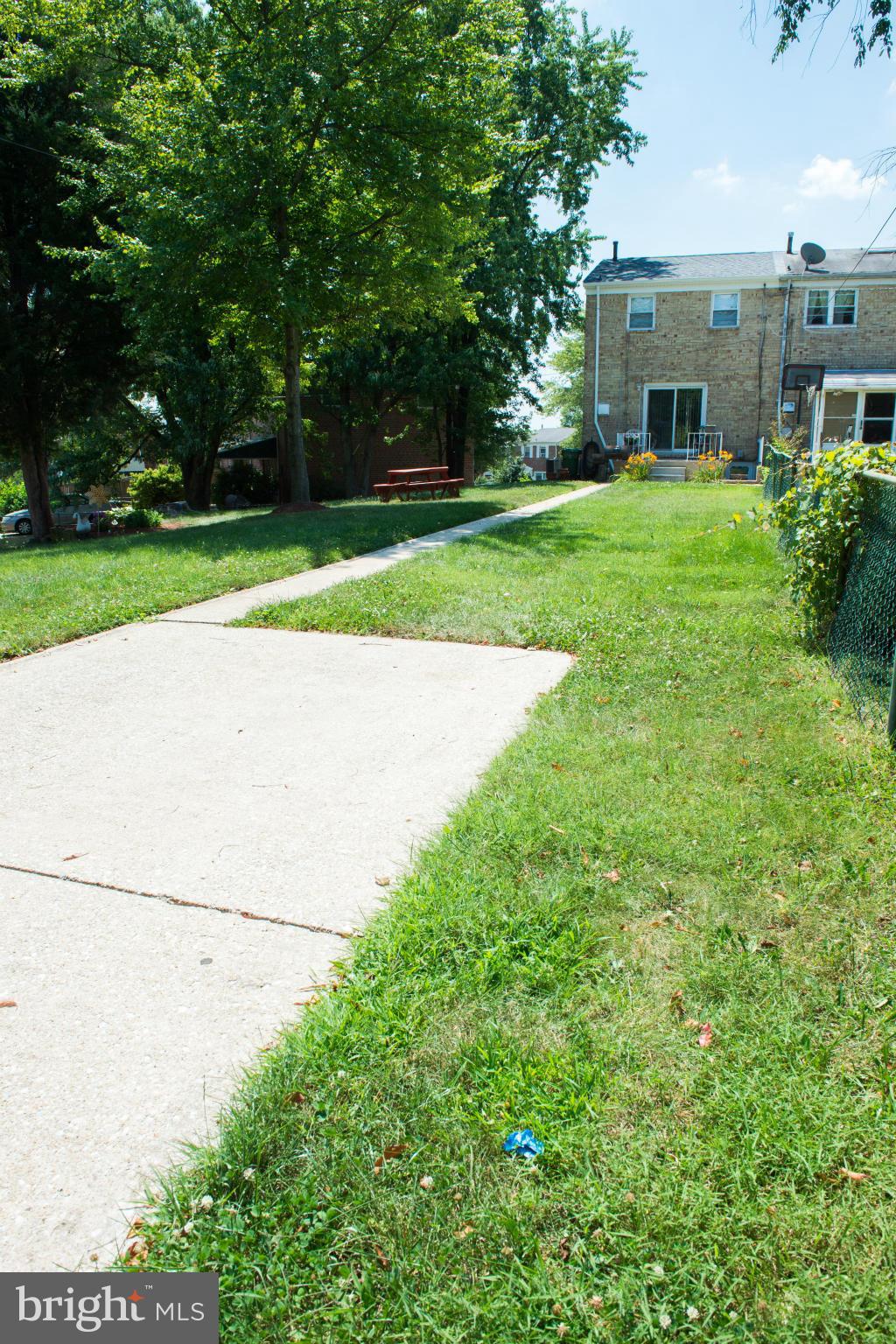 4738 Vancouver Road Baltimore, MD 21229 - Photo 29 of 30 a view of backyard with house and outdoor seating