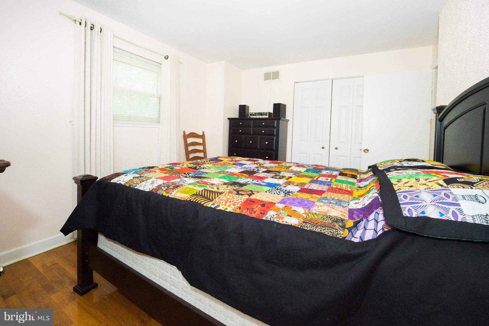 4738 Vancouver Road Baltimore, MD 21229 - Photo 7 of 30 a bedroom with a bed and a table in it