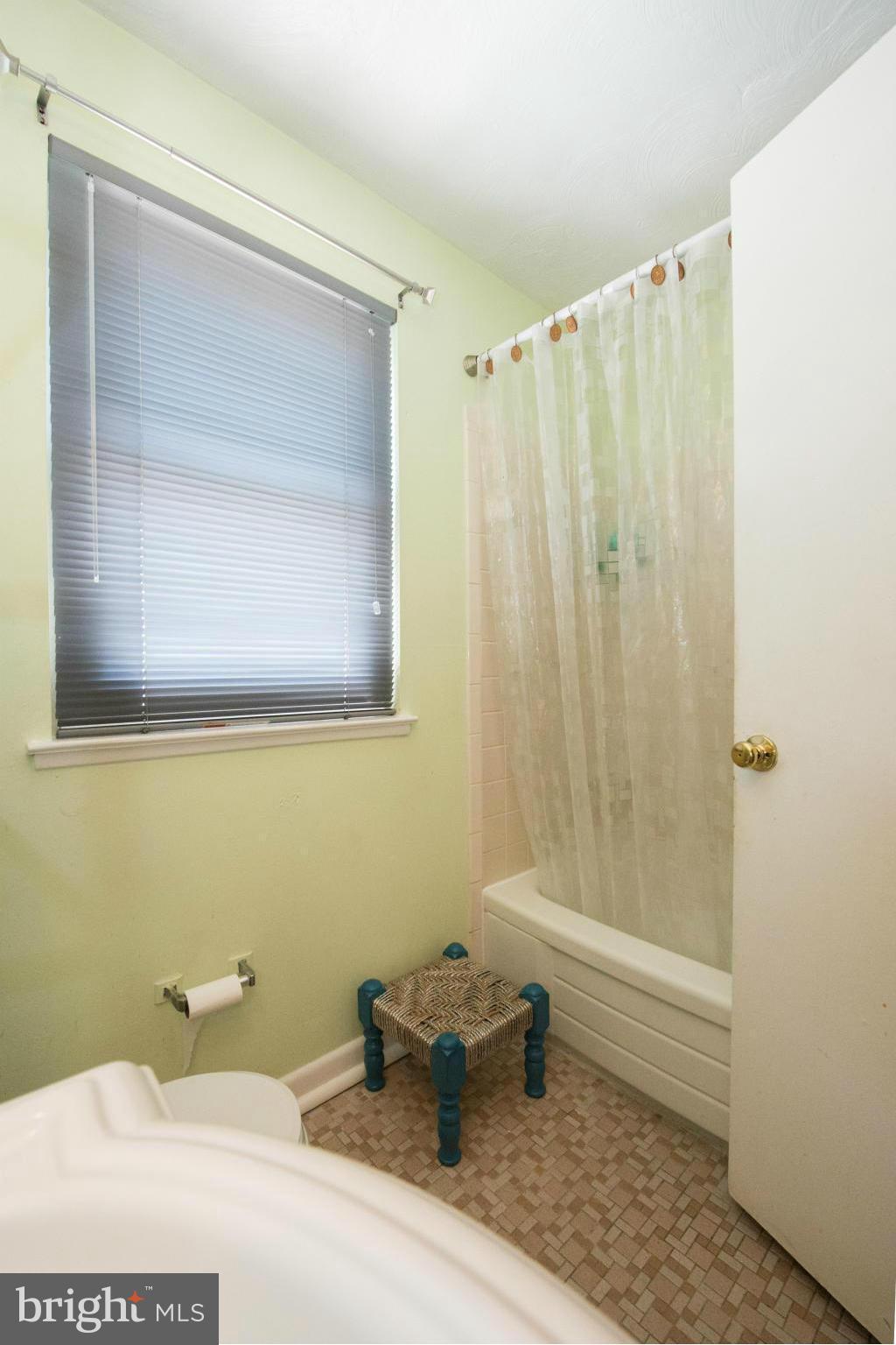 4738 Vancouver Road Baltimore, MD 21229 - Photo 9 of 30 a bathroom with a sink and a mirror