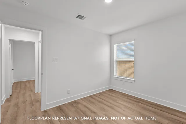 a bathroom with a granite countertop sink a toilet a mirror a bathtub and shower