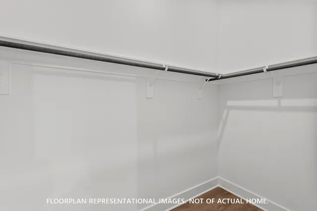 a bathroom with a sink mirror and vanity