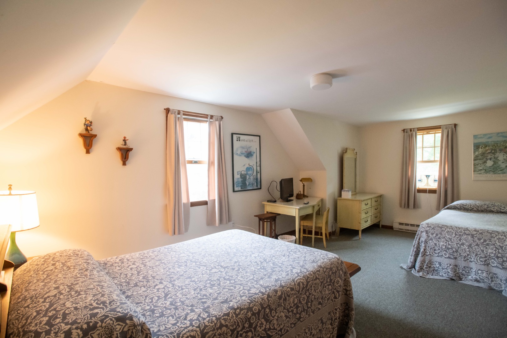134 Surfside Road Nantucket, MA 02554 - Photo 21 of 24 a bedroom with a bed and wooden floor