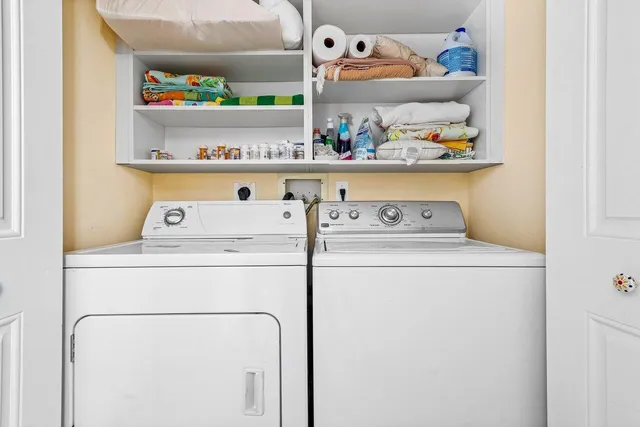 a view of a balcony with chair and a potted plant