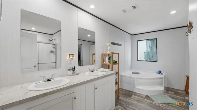 a room with furniture a chandelier and a window