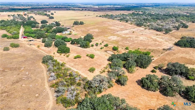 a view of a house with swimming pool and sitting area