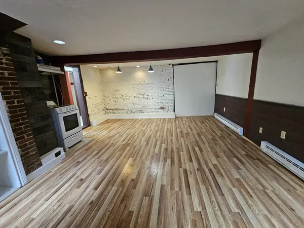 a view of a hardwood floor in a room