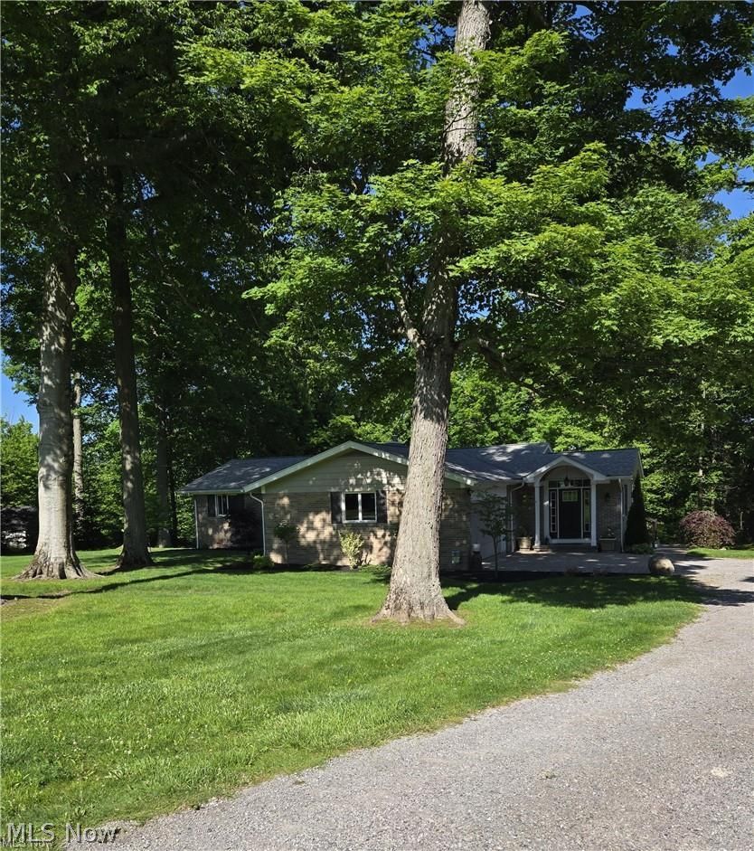 13725 Rockhaven Road Newbury, OH 44065 - Photo 1 of 31 Comfortably Nestled in between Huge trees