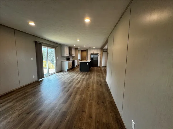 a view of a living room with a wooden floor
