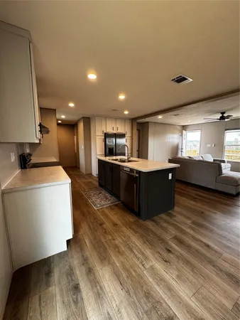 a view of kitchen with furniture and wooden floor