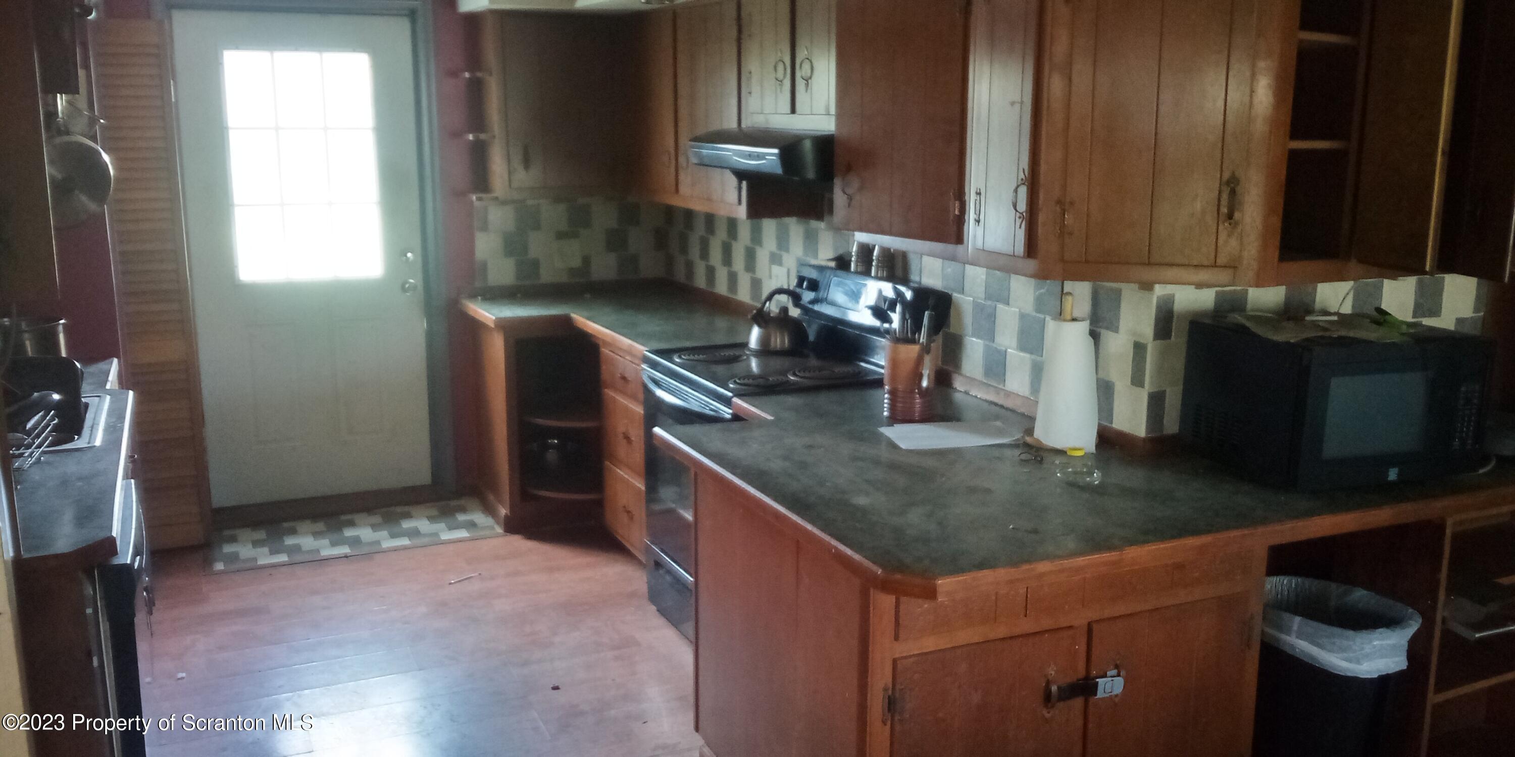 28 Williams Pond Road Montrose, PA 18801 - Photo 16 of 38 a kitchen with a sink and cabinets