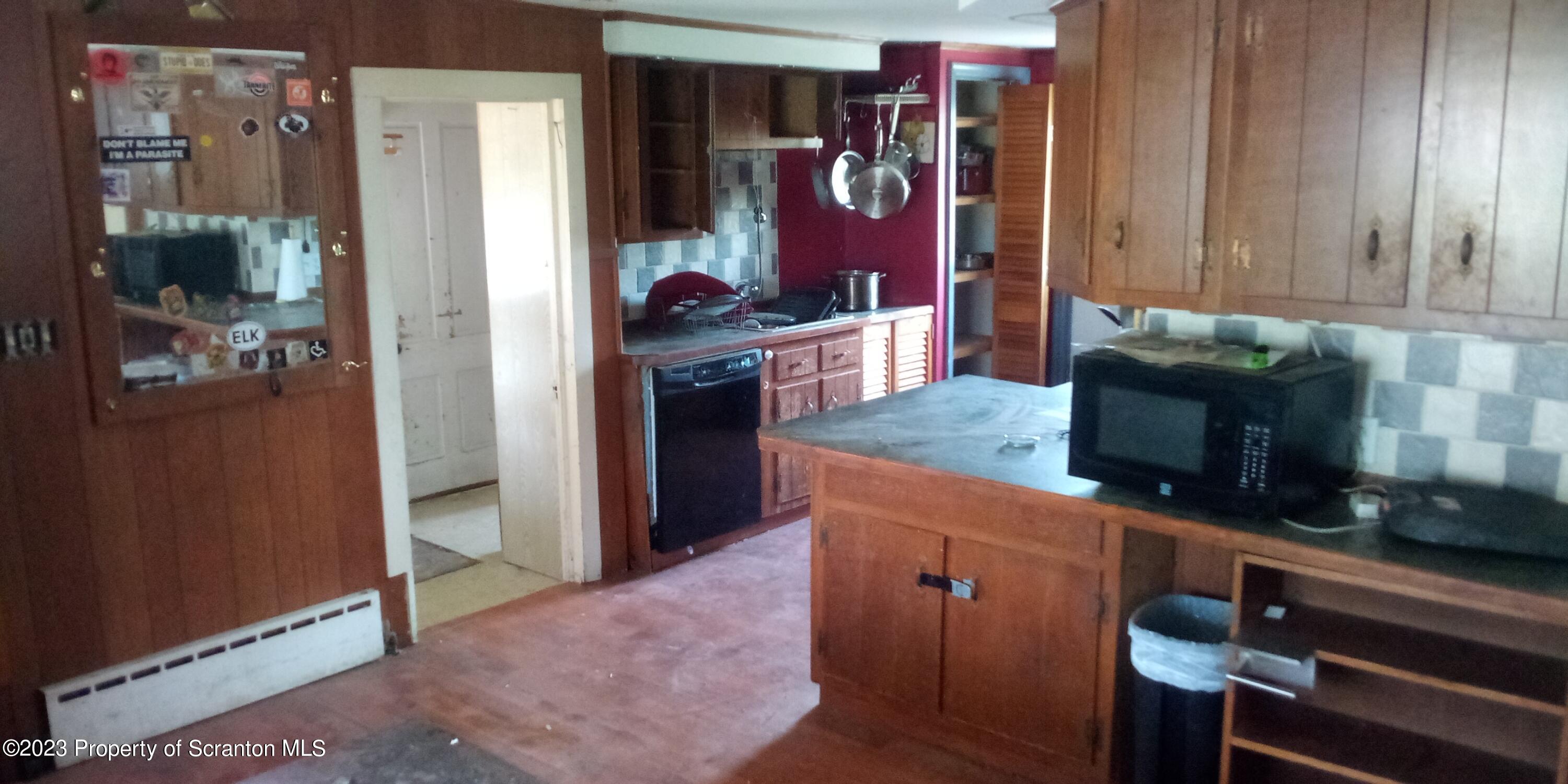 28 Williams Pond Road Montrose, PA 18801 - Photo 17 of 38 a kitchen with stainless steel appliances granite countertop a refrigerator and a stove
