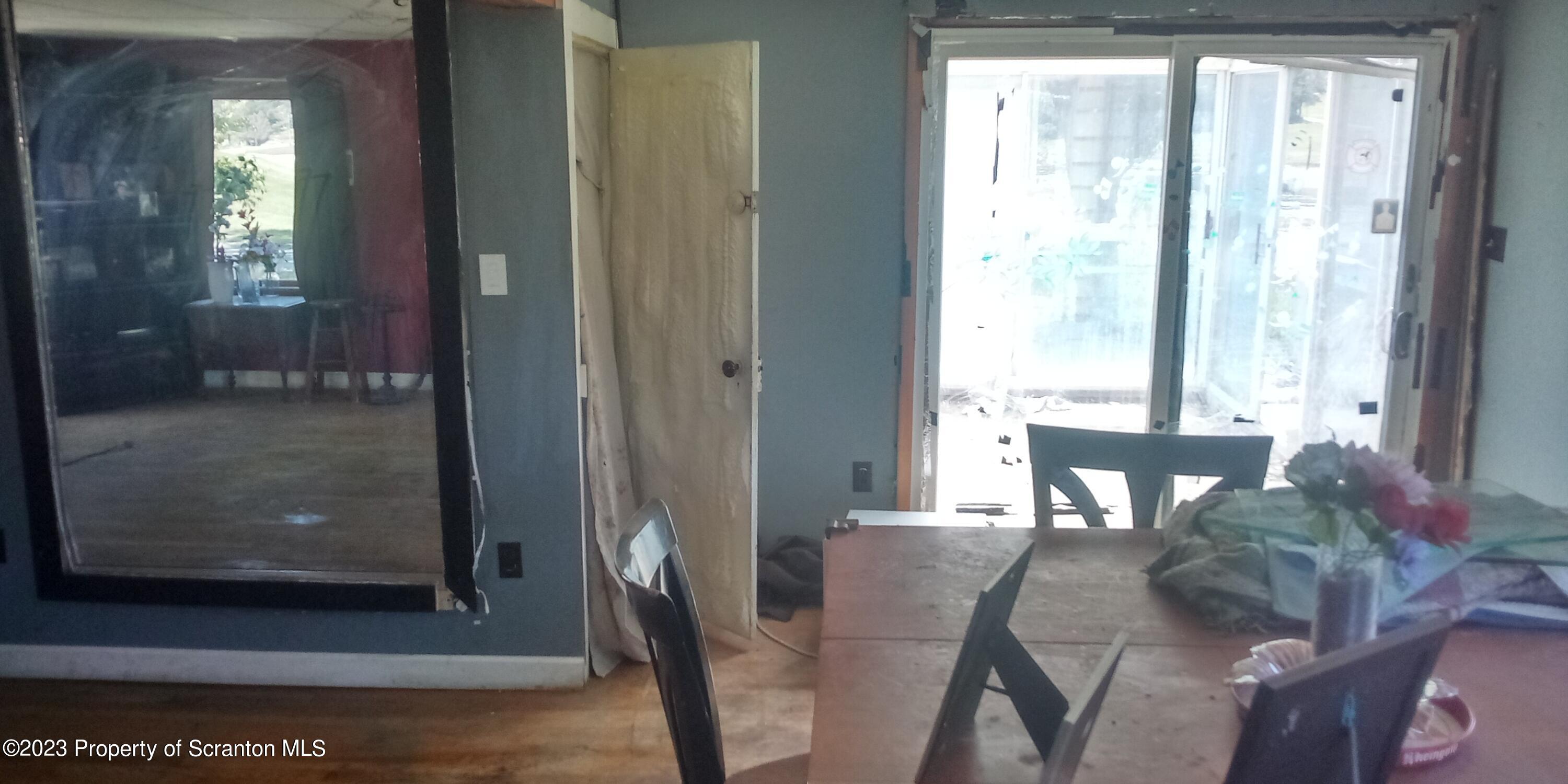 28 Williams Pond Road Montrose, PA 18801 - Photo 20 of 38 a view of a dining room with furniture and a window