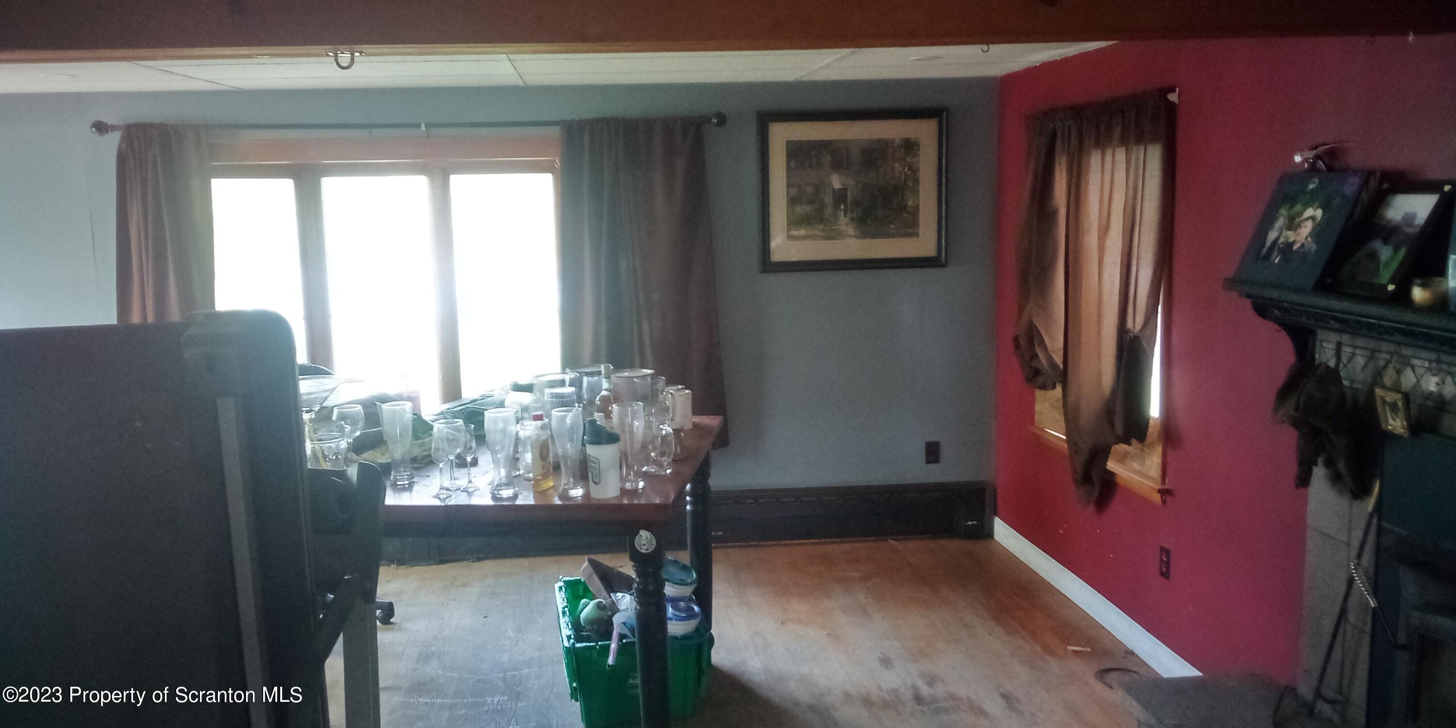 28 Williams Pond Road Montrose, PA 18801 - Photo 22 of 38 a view of a livingroom with furniture and a window
