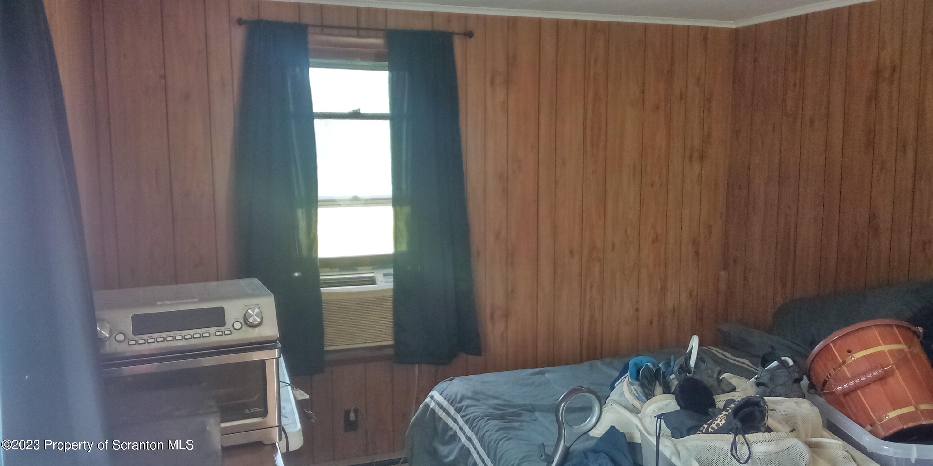 28 Williams Pond Road Montrose, PA 18801 - Photo 31 of 38 a bedroom with a bed and a window