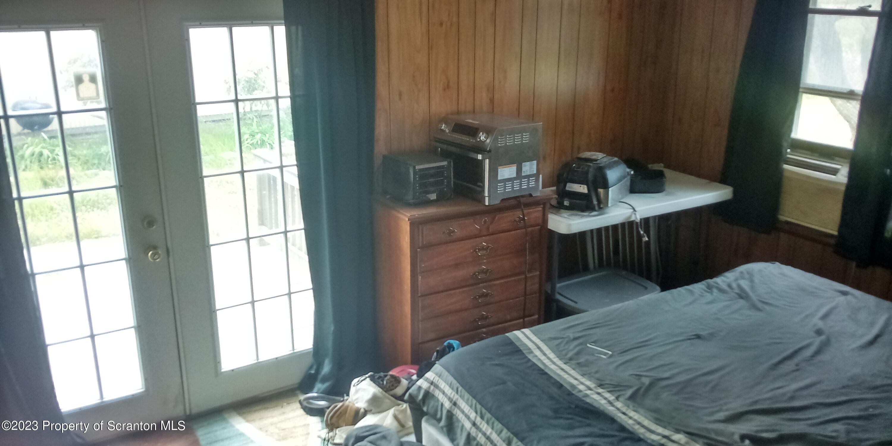 28 Williams Pond Road Montrose, PA 18801 - Photo 32 of 38 a bedroom with a bed and a window