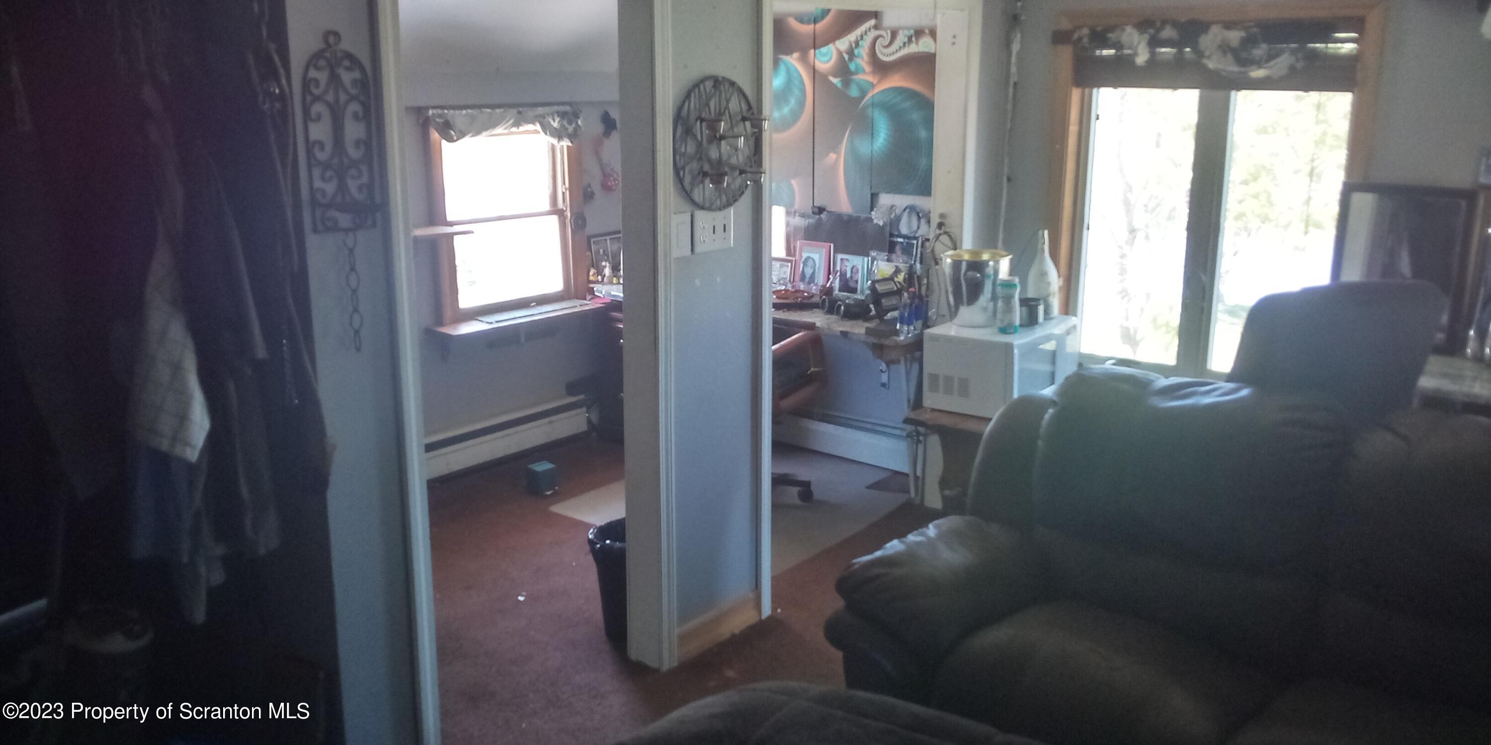 28 Williams Pond Road Montrose, PA 18801 - Photo 34 of 38 a living room with furniture and a window
