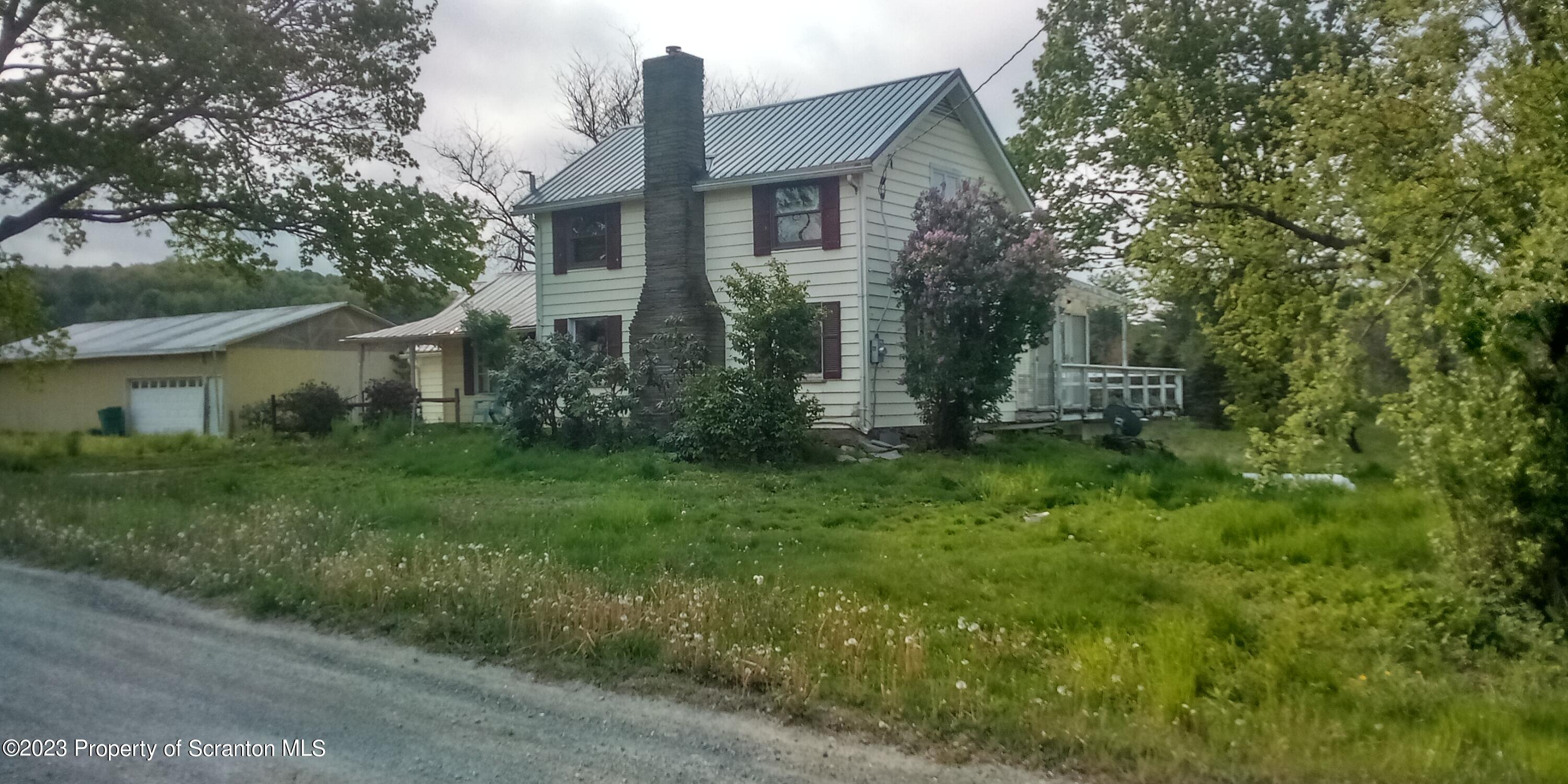 28 Williams Pond Road Montrose, PA 18801 - Photo 5 of 38 a front view of a house with garden