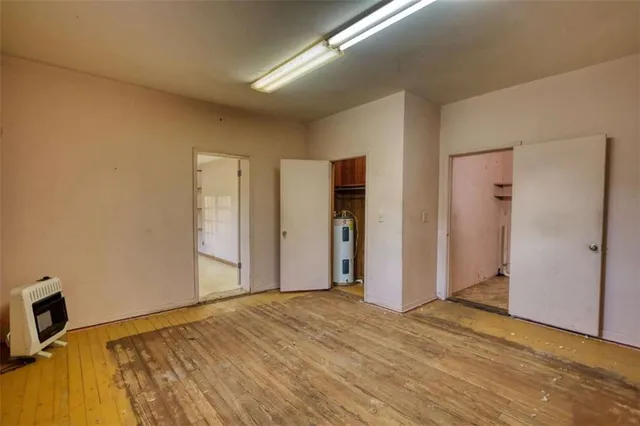 a bathroom with a tub sink and shower