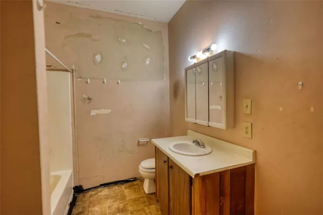 a bathroom with a bathtub and shower