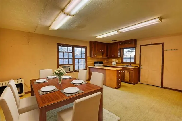 a large kitchen with cabinets and stainless steel appliances