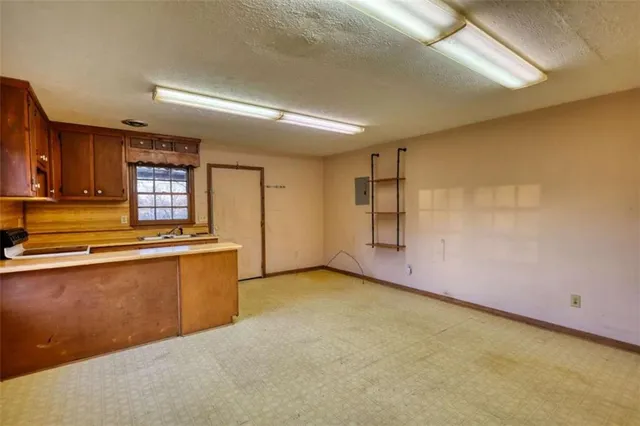 a kitchen that has a sink and a stove