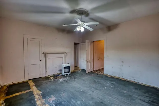 a bathroom with a toilet and shower
