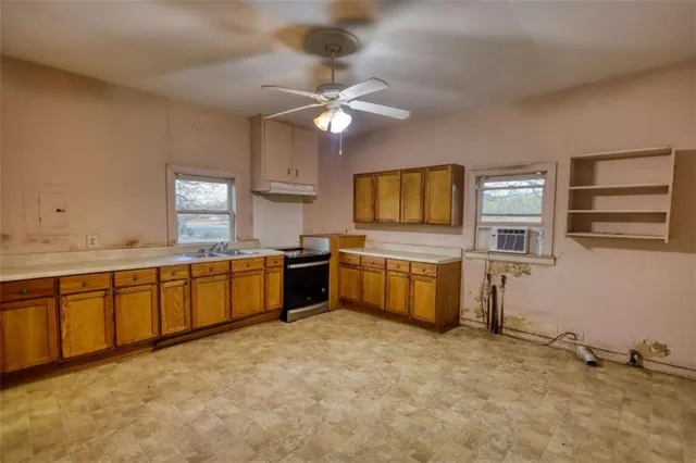 a view of an empty room with a bathroom
